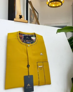 A honey yellow, clear view glass Swarovski buttons detailing African traditional senator kaftan native.