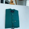 A Hunter green, flap with Swarovski button details, African traditional senator Kaftan native