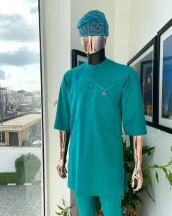 A Jade Green, front flap, valley perspective pocket design and Swarovski button details african traditional kaftan native.