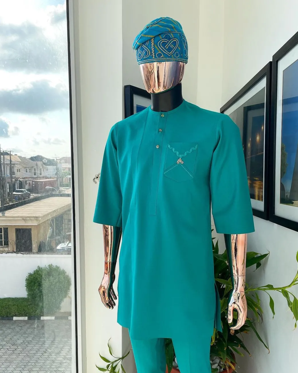 A Jade Green, front flap, valley perspective pocket design and Swarovski button details african traditional kaftan native.