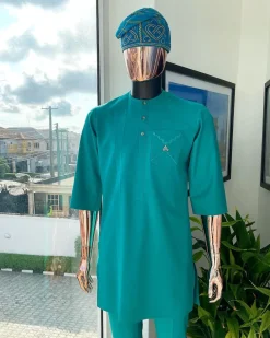 A Jade Green, front flap, valley perspective pocket design and Swarovski button details african traditional kaftan native.