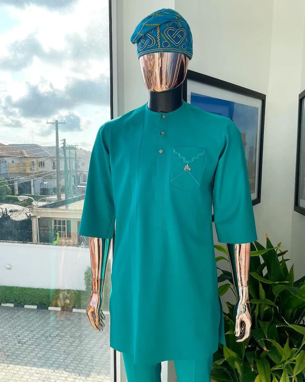 A Jade Green, front flap, valley perspective pocket design and Swarovski button details african traditional kaftan native.