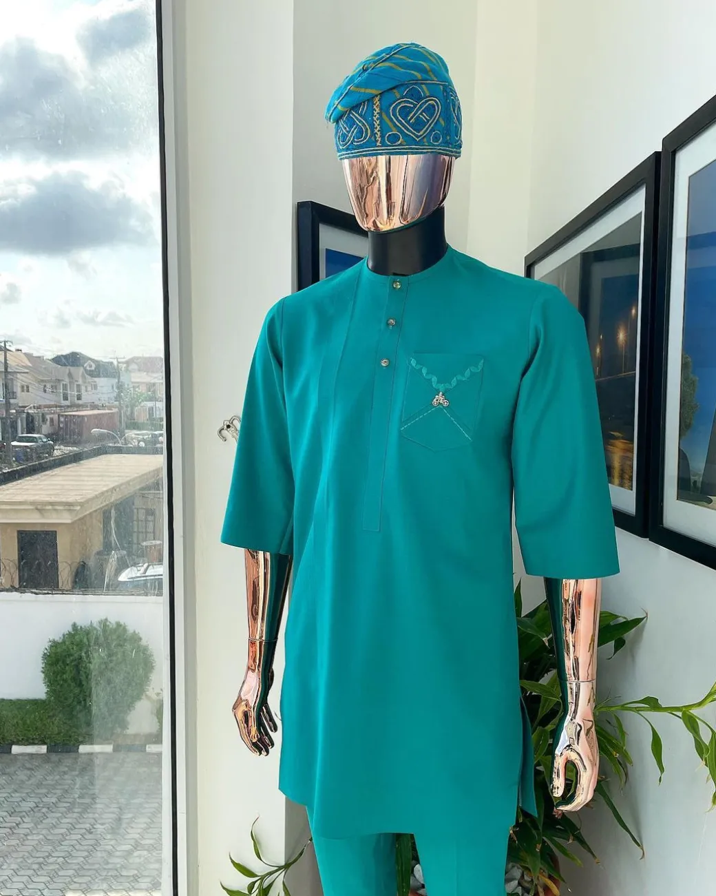 A Jade Green, front flap, valley perspective pocket design and Swarovski button details african traditional kaftan native.