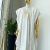 A “jakan” hand woven embroidery agbada, dashiki, sokoto with a cream wool patterned hat.