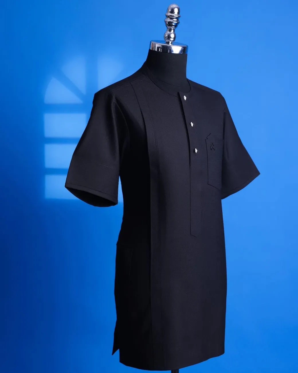 A Jorgecarli, charcoal black, invisible square patterns, front flap with silver Swarovski button African senator kaftan.