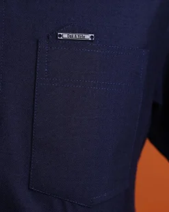 A Jorgecarli wool, midnight blue, invisible windowpane check, front flap with silver Swarovski button, shorts sleeve African senator kaftan native.