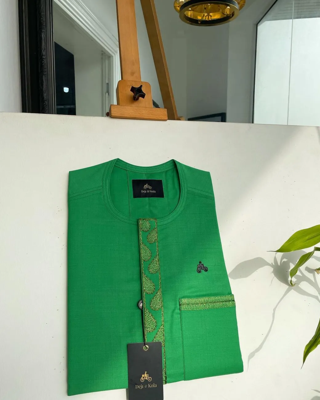 A Kelly green, wavy (plum) light front flap and pocket embroidery detailing African traditional senator kaftan native.