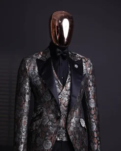 A knitted, brown, silver and black floral jacquard peak lapel suit