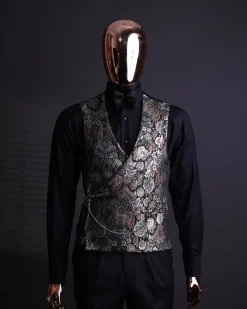 A knitted, brown, silver and black floral jacquard peak lapel suit