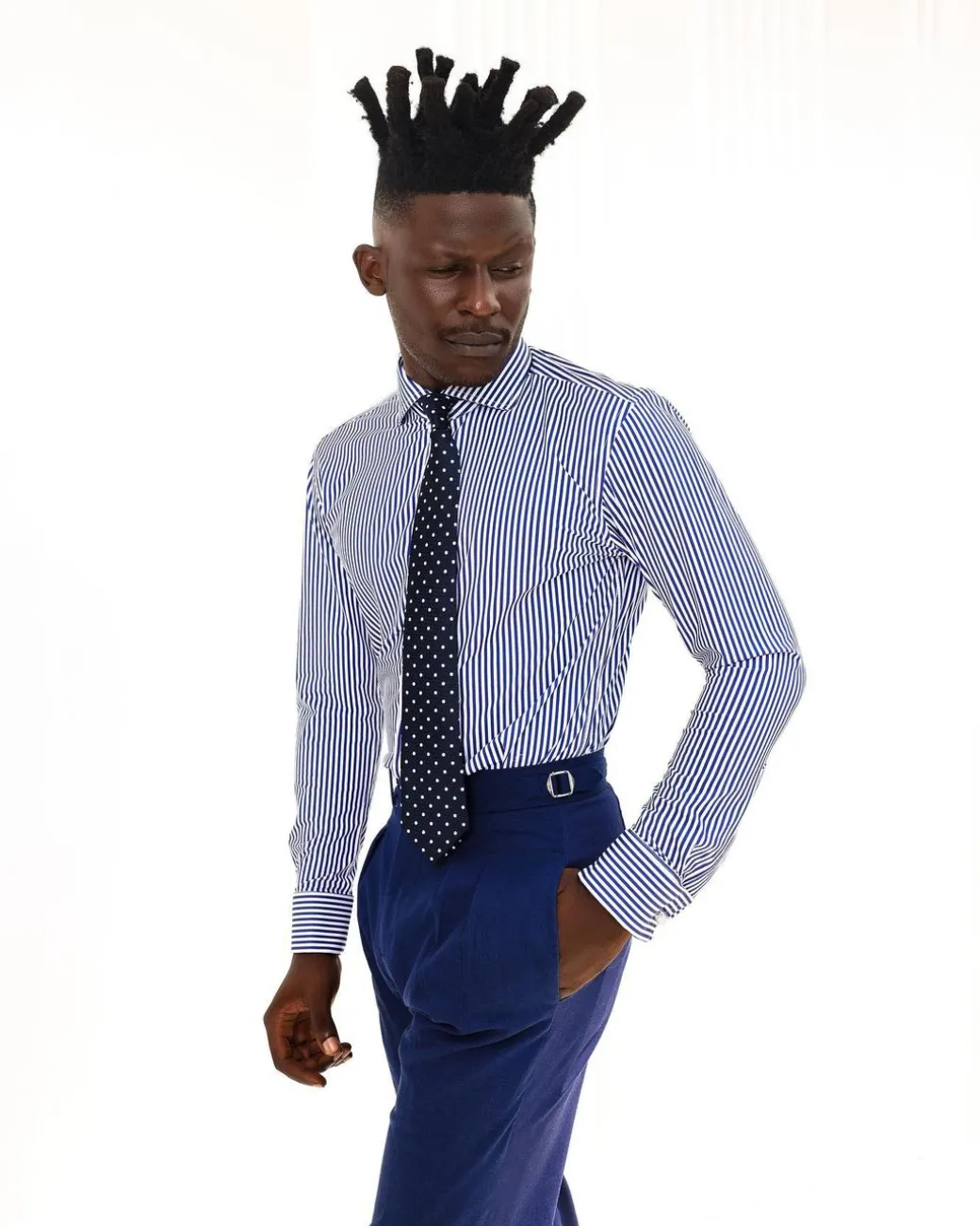 A knitted elastic, white and blue stripe shirt.