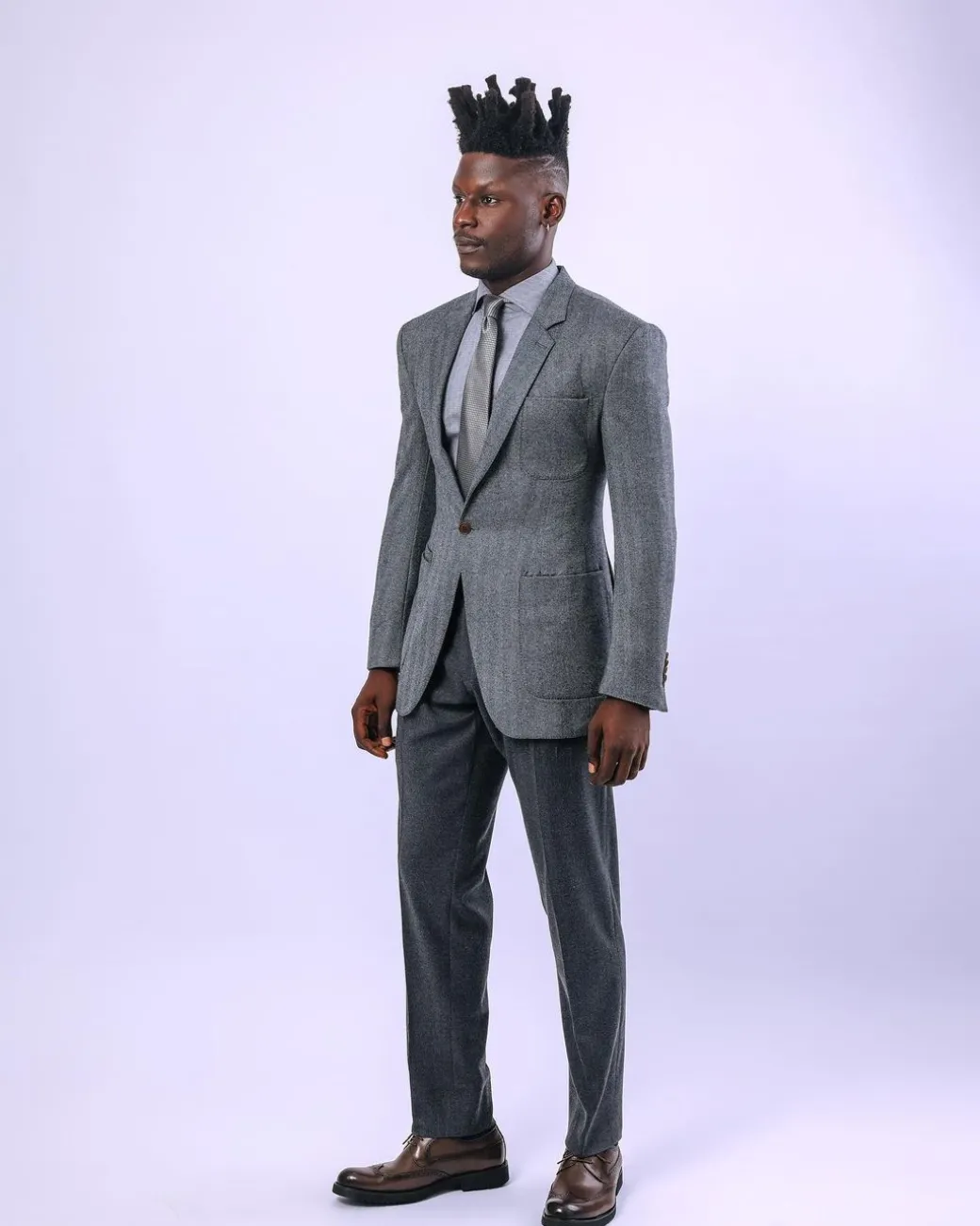 A knitted, Grey, notch lapel, patch pocket business suit