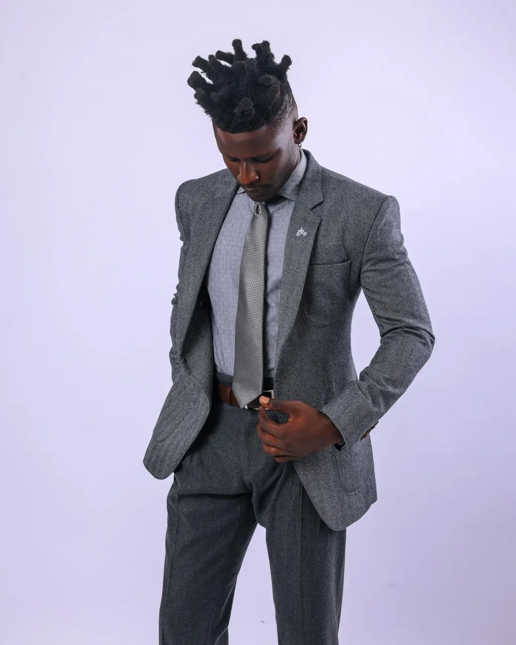 A knitted, Grey, notch lapel, patch pocket business suit