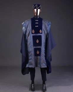 A “krosscut” layered, minted Gold, Skye, navy and admiral blue mix metallic jacquard front cut agbada.