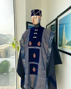A “krosscut” layered, minted Gold, Skye, navy and admiral blue mix metallic jacquard front cut agbada.