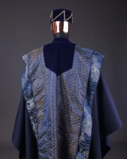 A “krosscut” layered, minted Gold, Skye, navy and admiral blue mix metallic jacquard front cut agbada.