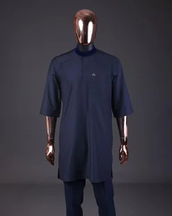 A “krosscut” layered, minted Gold, Skye, navy and admiral blue mix metallic jacquard front cut agbada.