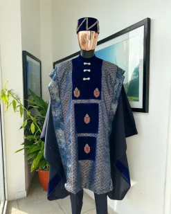 A “krosscut” layered, minted Gold, Skye, navy and admiral blue mix metallic jacquard front cut agbada.