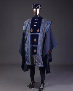 A “krosscut” layered, minted Gold, Skye, navy and admiral blue mix metallic jacquard front cut agbada.