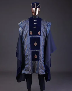 A “krosscut” layered, minted Gold, Skye, navy and admiral blue mix metallic jacquard front cut agbada.