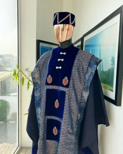 A “krosscut” layered, minted Gold, Skye, navy and admiral blue mix metallic jacquard front cut agbada.