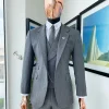 A Lava Grey, herringbone-patterned fabric Jorgecarli Super 140’s “Board Room” notch lapel suit