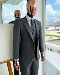 A Lava Grey, herringbone-patterned fabric Jorgecarli Super 140’s “Board Room” notch lapel suit