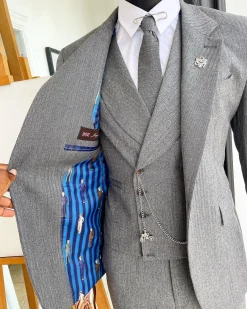 A Lava Grey, herringbone-patterned fabric Jorgecarli Super 140’s “Board Room” notch lapel suit