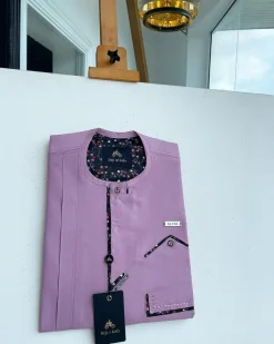 A lavender-purple invisible flap with an invisible pocket, paisley, and Swarovski button details African traditional senator Kaftan native