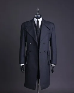 A Lead grey, double breasted, notch lapel trench coat with combat pocket.