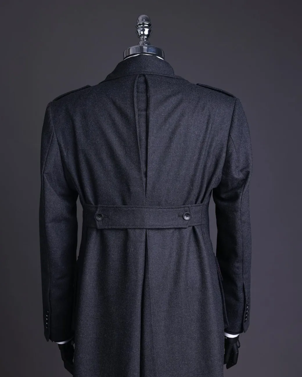 A Lead grey, double breasted, notch lapel trench coat with combat pocket.