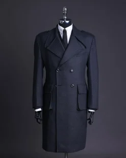 A Lead grey, double breasted, notch lapel trench coat with combat pocket.