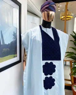 A Light blue, connected square navy blue embroidery Agbada