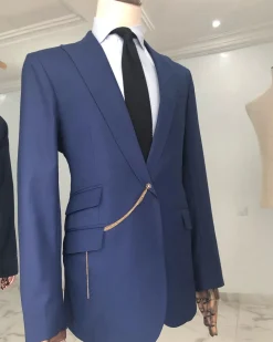 A Light Blue, Peak Lapel, One Button Tailored Suit with Gold Detailing