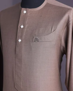 A Light brown, jorgecarli fabric, front flap with silver Swarovski button, long sleeve African senator kaftan native.