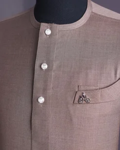 A Light brown, jorgecarli fabric, front flap with silver Swarovski button, long sleeve African senator kaftan native.