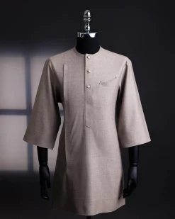 A Light cedar brown, Jorgecarli wool, front flap, layered suit & pen pocket, 3/4 sleeve and clear view silver Swarovski button African senator kaftan native.