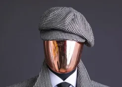 A Light Grey And Black Mix Of Houndstooth Check Hat.