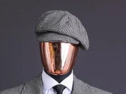 A Light Grey And Black Mix Of Houndstooth Check Hat.