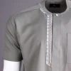 A Light grey, front flap with silver studded Swarovski buttons, left drop Arewa embroidery, short sleeve African senator kaftan native