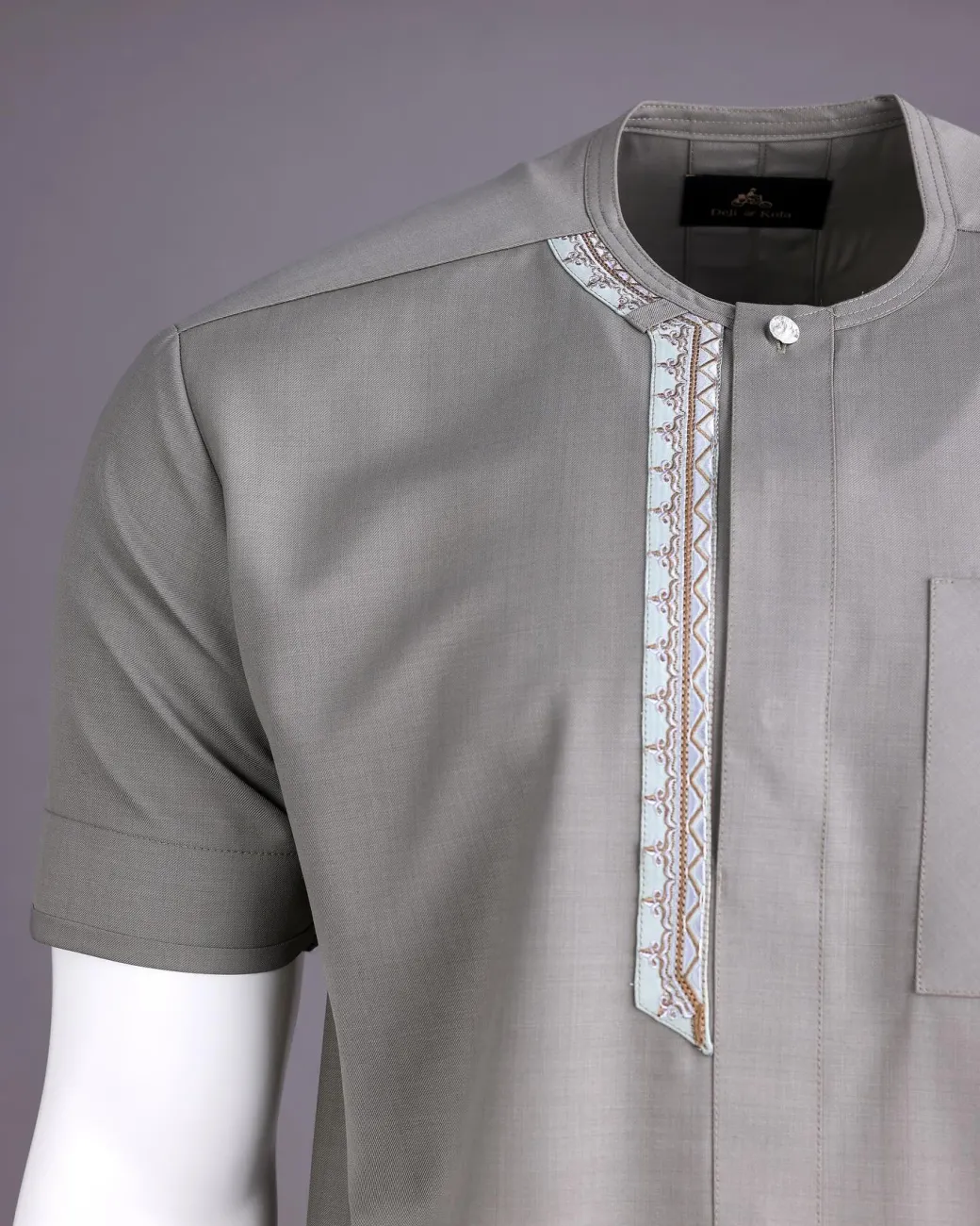 A Light grey, front flap with silver studded Swarovski buttons, left drop Arewa embroidery, short sleeve African senator kaftan native
