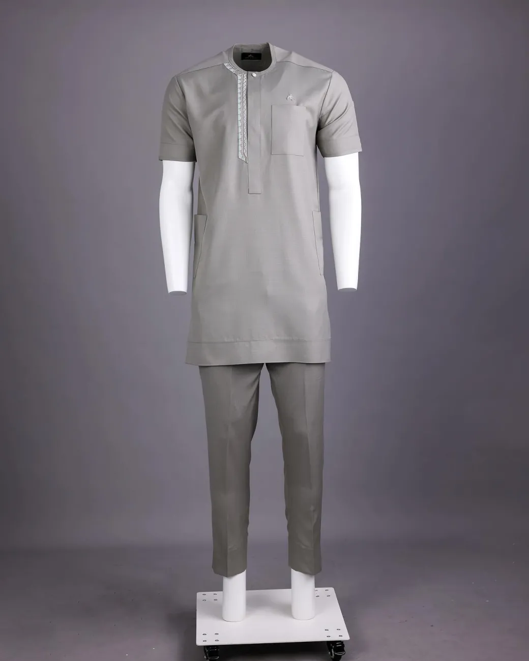 A Light grey, front flap with silver studded Swarovski buttons, left drop Arewa embroidery, short sleeve African senator kaftan native