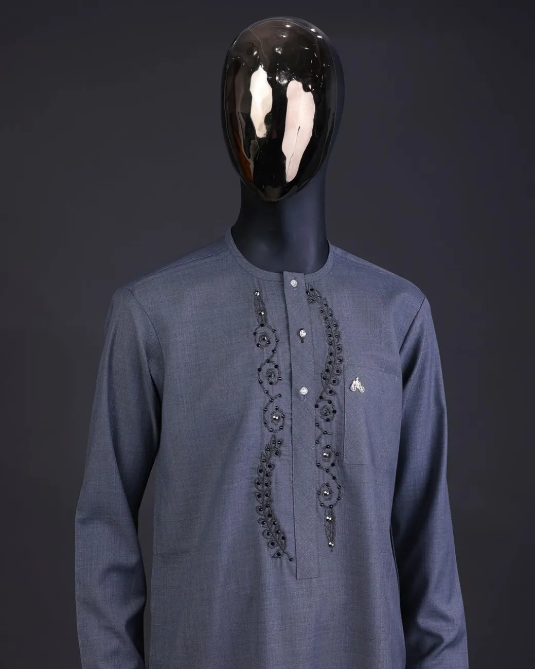 A Light grey, patterned floral embroidery details with black Swarovski stone details, silver button, long sleeve kaftan and Sokoto
