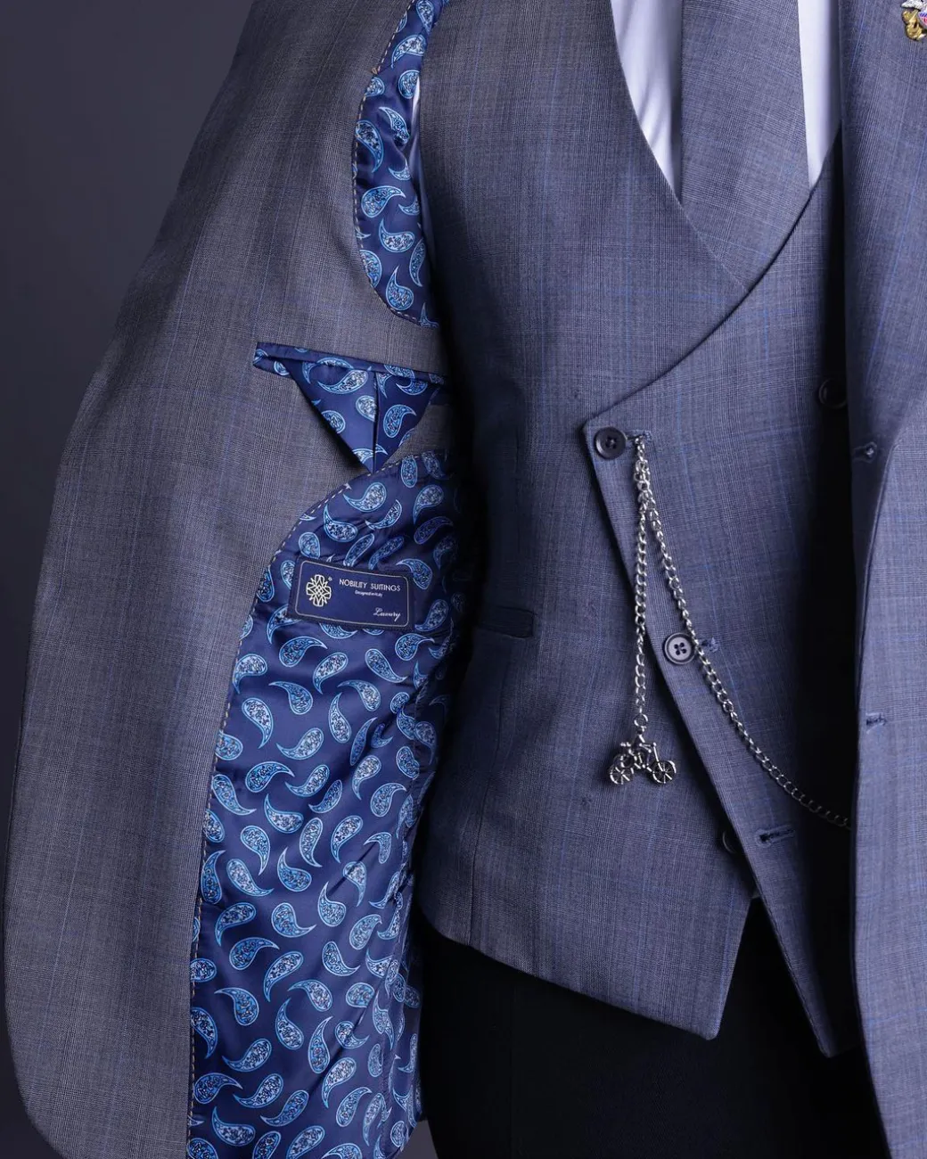 A light grey, windowpane check, monochrome nobility super “140s” “Board Room” Notch lapel suit