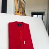 A lipstick red, patch pocket, front flap with clear view lipstick red Swarovski button details African Kaftan