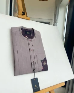 A liver brown, curved reverse pocket, front flap with purple Swarovski African kaftan native