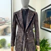 A “Made In Lagos”, Quad peak lapel, triple breasted metallic jacquard blazer suit