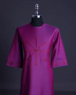 A Magenta, herringbone fabric, and interconnected ring embroidery details African senator kaftan native
