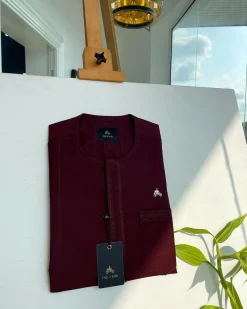 A mahogamy red, spiral layered flap and pocket embroidery detailing african traditional senator kaftan native.
