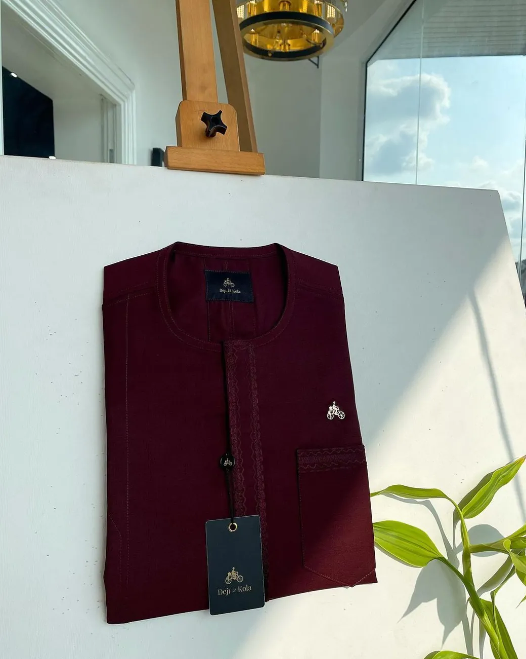 A mahogamy red, spiral layered flap and pocket embroidery detailing african traditional senator kaftan native.