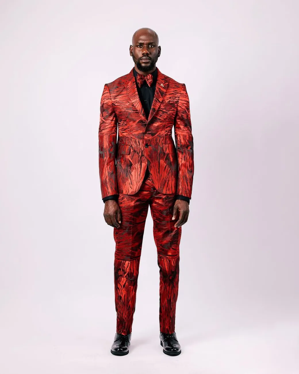 A Mahogany Red “Black Tears” Inverted Pattern Peak Lapel Jacquard Suit